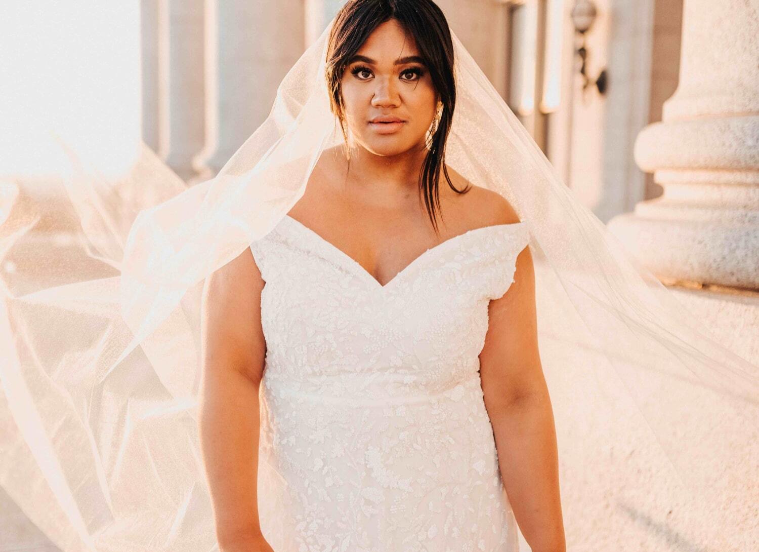 Model wearing a white wedding dress