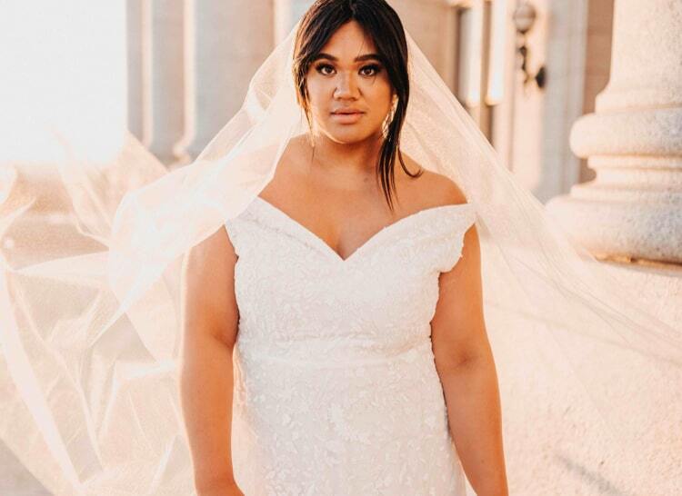 Model wearing a white wedding dress