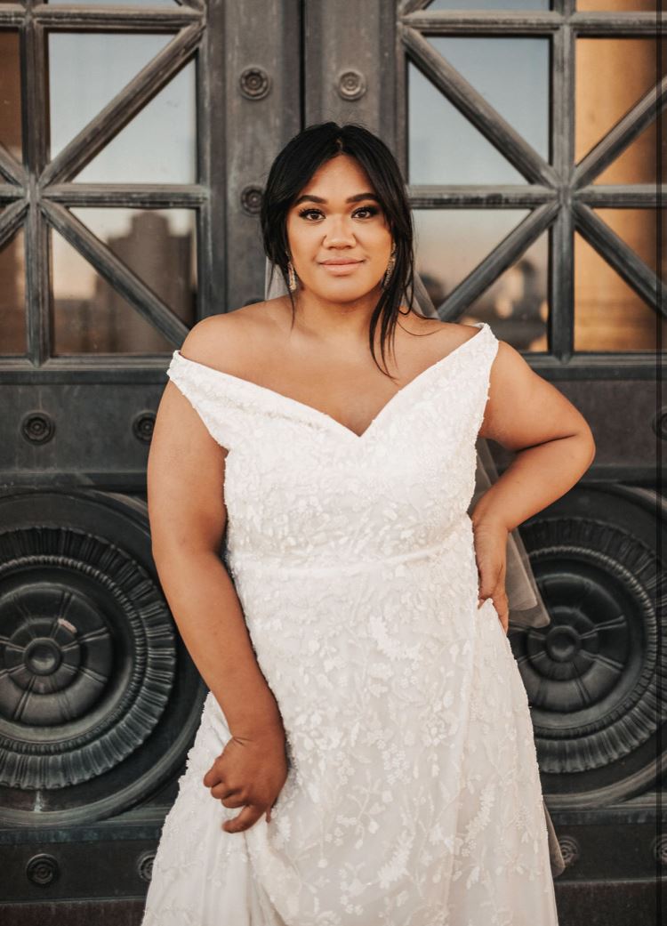 Model wearing a white gown