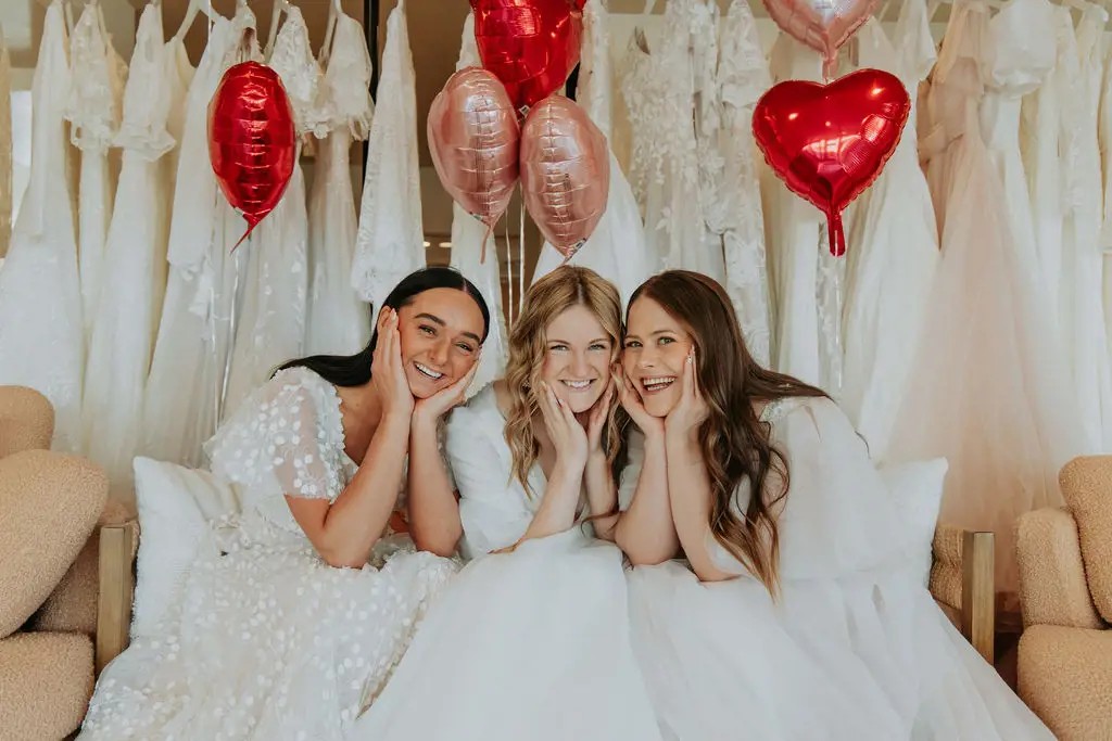 Models wearing a white dresses