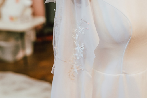 White fabric with star embellishments on mannequin