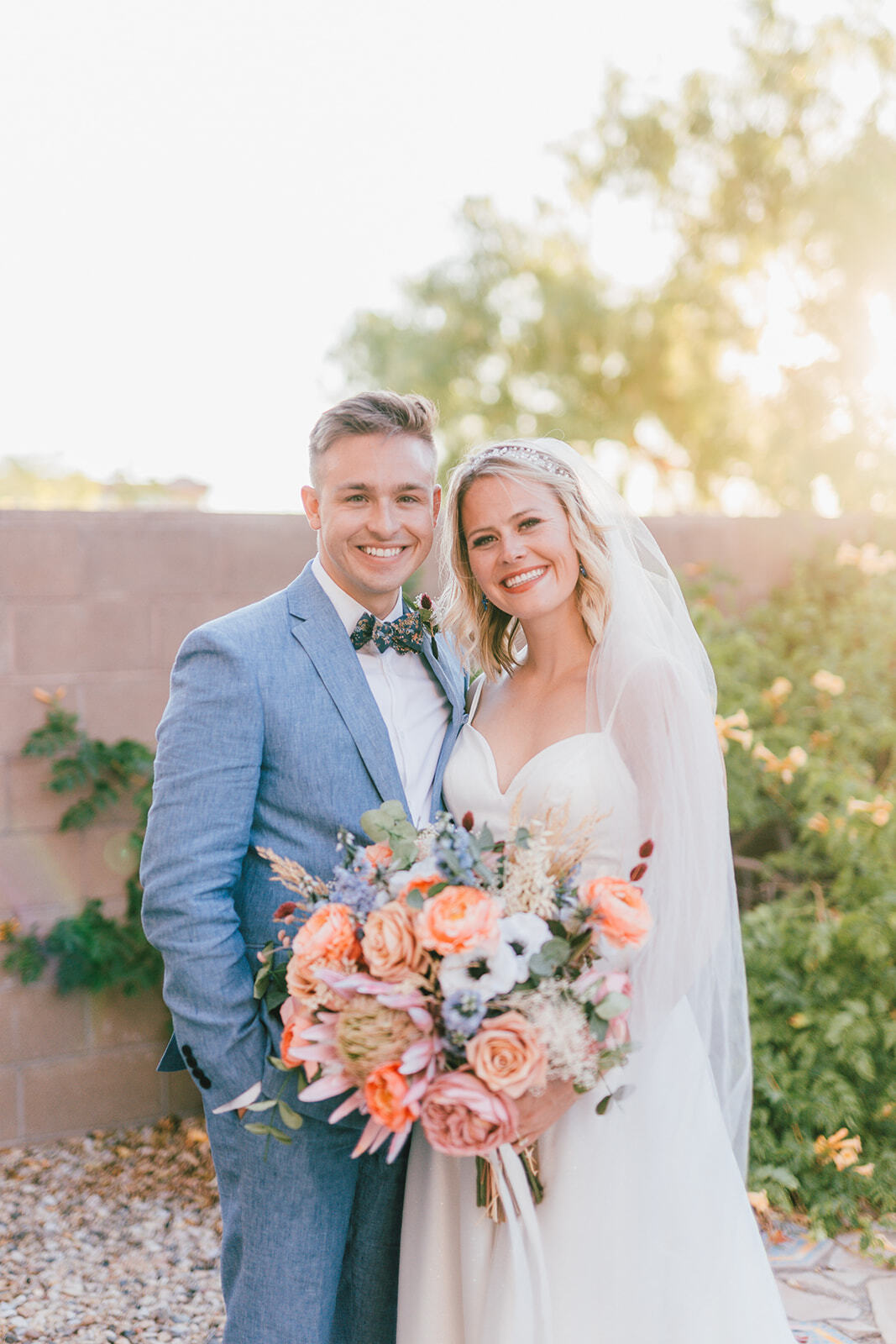 Сouple wearing a white gown and a blue suit